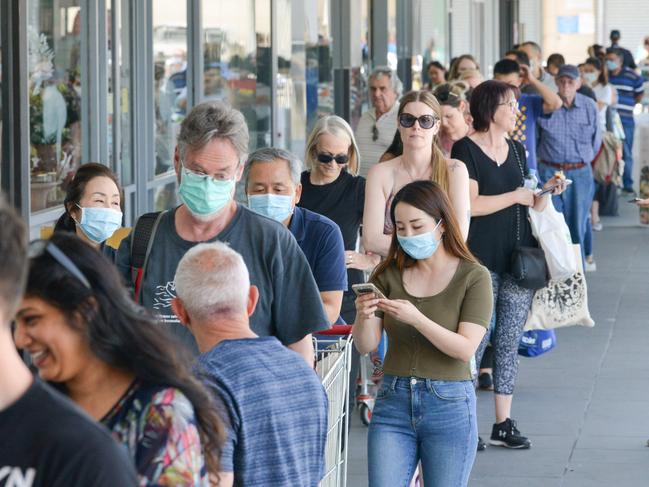 People queue at a supermarket after the South Australian state government announced a six-day lockdown because of the Covid-19 outbreak in Adelaide on November 18, 2020. This was the infamous ‘pizza box’ incident. Picture: Brenton Edwards/AFP