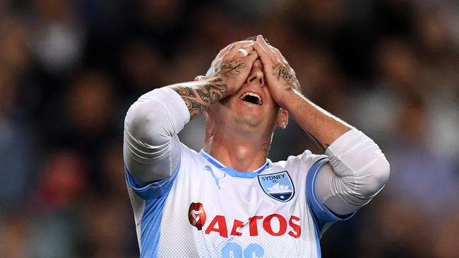 Luke Wilkshire of Sydney reacts after missing a scoring chance