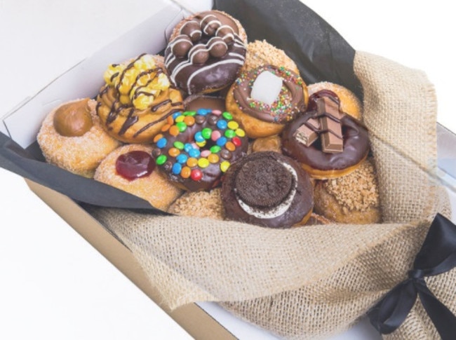 For partners with a sweet tooth, My Sweet Box’s Gourmet Bouquet is filled with 12 large mixed and six mini gourmet doughnuts.