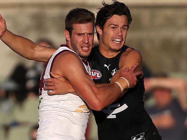 Grant Birchall of the Lions and Jack Silvagni of the Blues in action during the Round 5 AFL match between the Fremantle Dockers and the Brisbane Lions at Fremantle Oval in Perth, Sunday, March 8, 2020. (AAP Image/Sean Garnsworthy) NO ARCHIVING, EDITORIAL USE ONLY