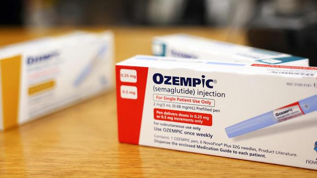 (FILES) This photo illustration shows boxes of the diabetes drug Ozempic resting on a pharmacy counter in Los Angeles, California, on April 17, 2023. Over 40 percent of Americans suffer from obesity, reflecting a major health crisis and the massive market for new Ozempic-type drugs. With their "groundbreaking" effectiveness, the drugs will be "the first line therapy for people who are obese," research physician Samuel Klein of Washington University in St. Louis told AFP. (Photo by MARIO TAMA / GETTY IMAGES NORTH AMERICA / AFP)