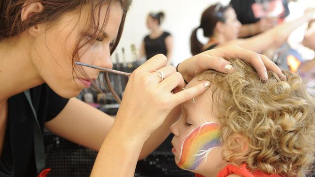 Alix McDermott face-painting in 2013.