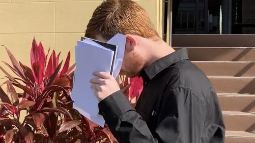 Tyler Jay Halliday tried to hide his face as he left Mackay Magistrates Court. Photo: Janessa Ekert