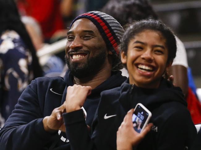 Kobe and Gianna at a game between Long Beach State and Oregon. (AP Photo/Ringo H.W. Chiu)