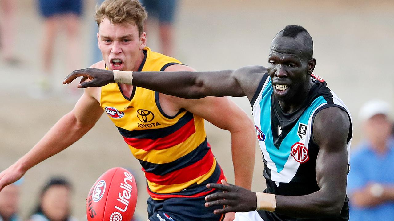 Aliir Aliir of Port Adelaide and Riley Thilthorpe of the Adelaide Crows.