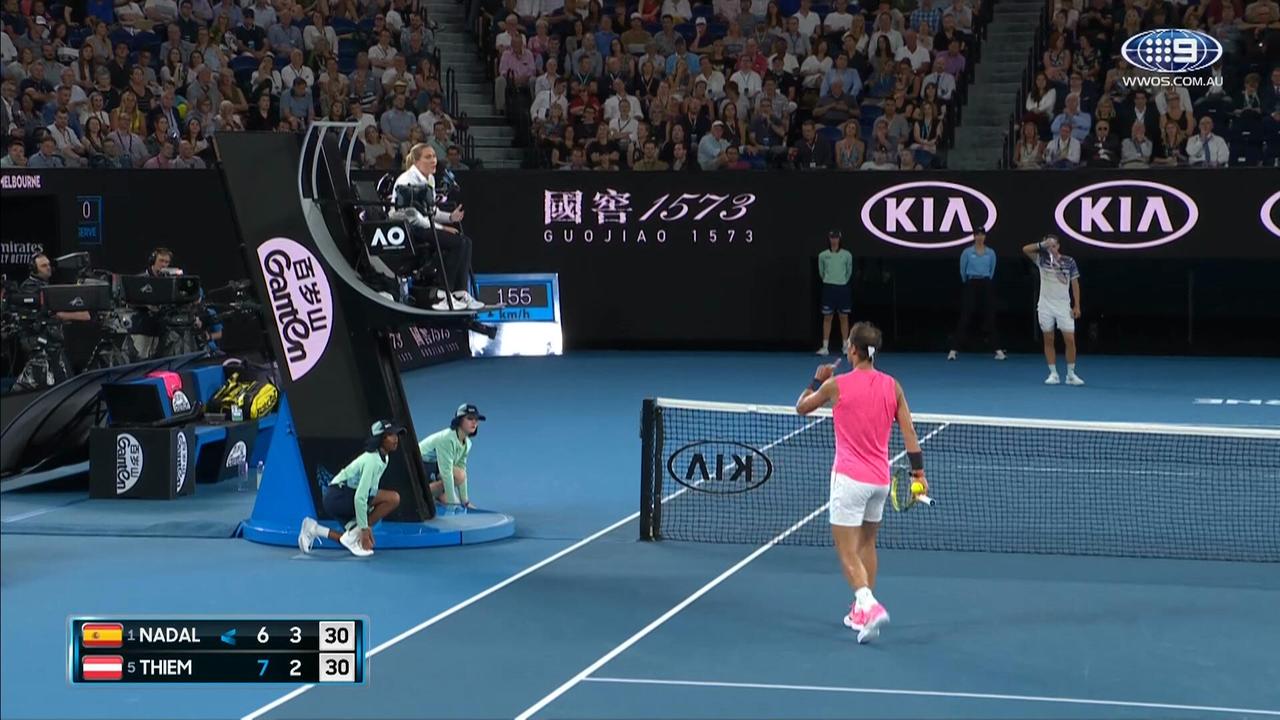 Rafael Nadal confronts the chair umpire after receiving a time violation in the second set against Dominic Thiem.