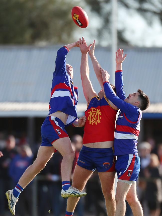 Incoming Marong co-coach Kain Robins is sandwiched between two Pyramid Hill defenders in the Loddon Valley grand final this year. Picture: Yuri Kouzmin