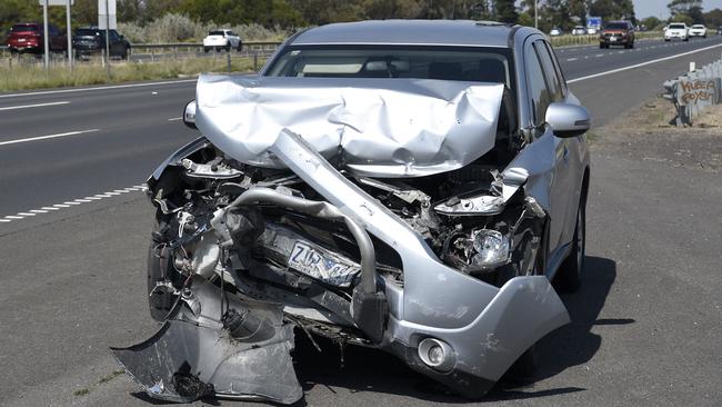 An abandoned car on the Princes Freeway at Little River. Picture: Andrew Henshaw