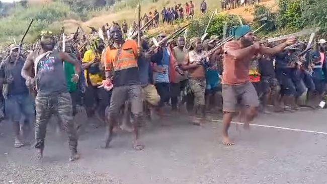 Tribal fighters in Papua New Guinea’s Enga Province face off in a show of their strength, with many brandishing home-made guns and metre-long bush knives that leave victims with devastating wounds. Picture: Facebook