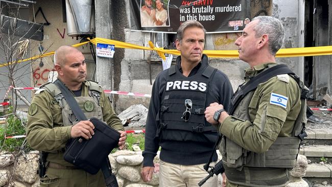 Lachlan Murdoch speaks with Rear Admiral Daniel Hagari, right, in Kibbutz Kfar Aza, where scores of Israelis were killed on October 7.