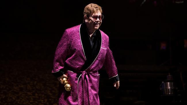 Elton John holding his Golden Globe at the Sydney concert on Feb 7 when he also announced the million dollar donation to bushfire relief. Picture: Rocket Entertainment / Ben Gibson