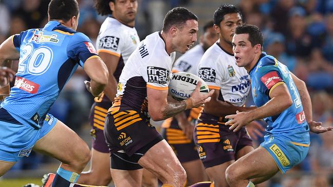 Broncos player Darius Boyd takes the ball up during the Round 5 NRL match between the Gold Coast Titans and the Brisbane Broncos at CBUS Stadium on the Gold Coast, Friday, April 1, 2016. (AAP Image/Dave Hunt) NO ARCHIVING, EDITORIAL USE ONLY