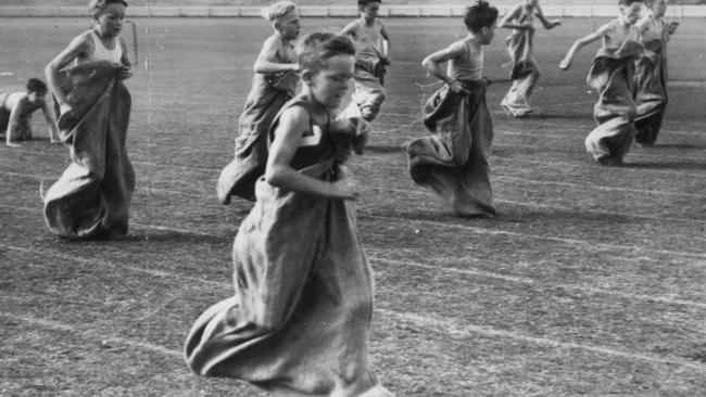 Athletics - Christian Brothers College (CBC) Sports Day at Adelaide.   N. Poore (nearest camera) wins the under-12 sack race.  Date Stamped 24 Apr 1947. (The Advertiser photograph Krischock)