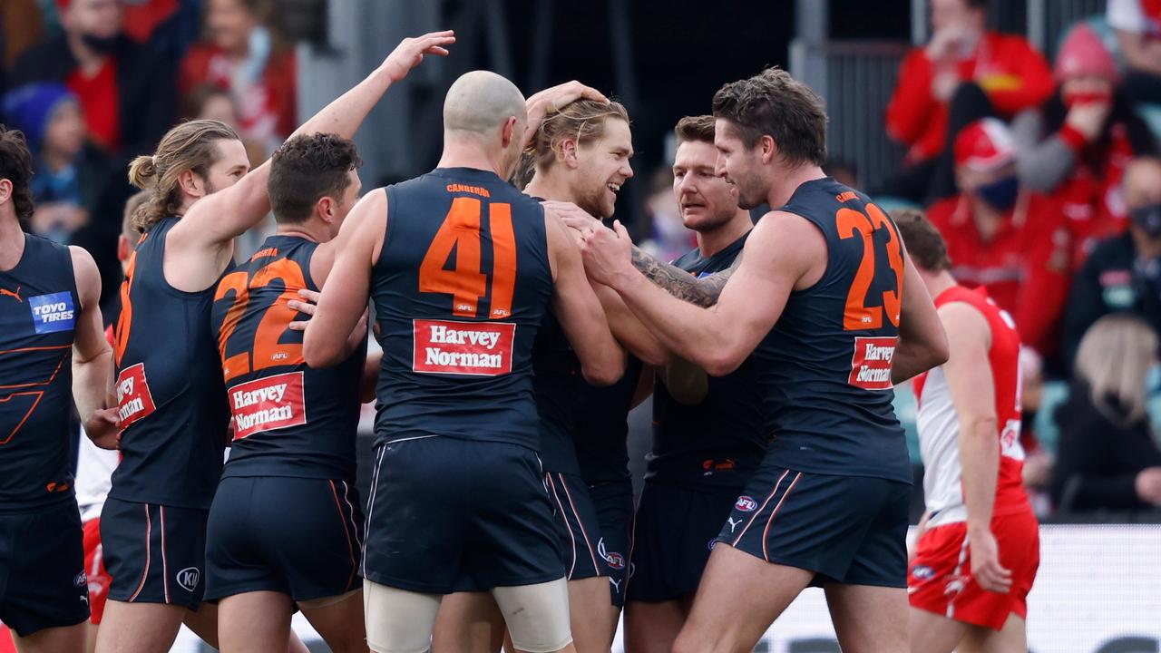 LAUNCESTON, AUSTRALIA - AUGUST 28: Harry Himmelberg (C) of the Giants celebrates a goal with his teammates during the 2021 AFL Second Elimination Final match between the Sydney Swans and the GWS Giants at University of Tasmania Stadium on August 28, 2021 in Launceston, Australia. (Photo by Rob Blakers/Getty Images)