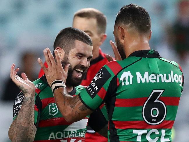 SYDNEY, AUSTRALIA - APRIL 08:  Adam Reynolds of the Rabbitohs celebrates with team mates after scoring a try during the round five NRL match between the South Sydney Rabbitohs and the Brisbane Broncos at Stadium Australia on April 08, 2021, in Sydney, Australia. (Photo by Mark Metcalfe/Getty Images)