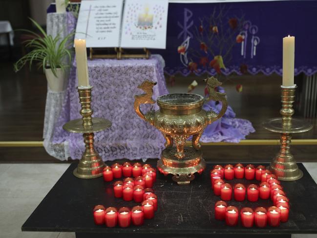 Candles are arranged in a "39" during a Mass and vigil for the 39 victims found dead inside the back of a truck in Essex. Picture: AP