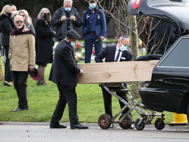 Geoffrey Edelsten‘s coffin - a plain casket - arrives at Springvale Cemetery to be laid to rest. Picture: David Caird