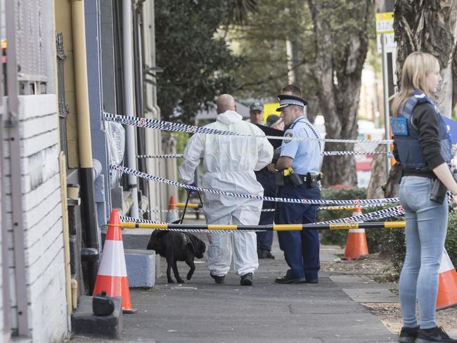 Police at one of the addresses raided over a terror plot a week ago that will likely see stringent new security measures at airports. Picture: Brook Mitchell.