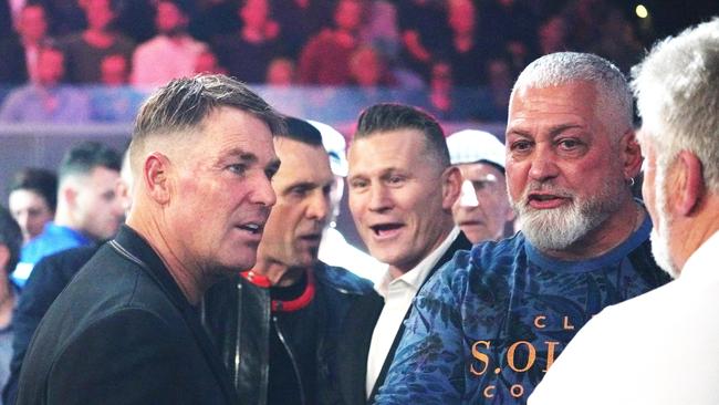 Former cricketer Shane Warne chats with Mick Gatto during the Code War Boxing night. Picture: Michael Dodge/AAP.