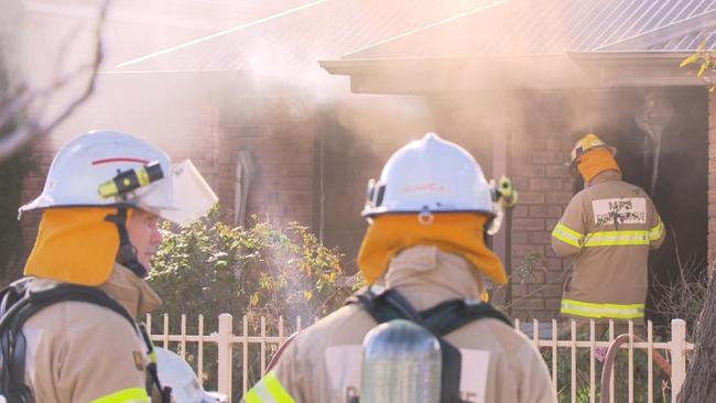 A woman has been rushed to hospital after a fire in Angle Park on Friday. Picture: 7NEWS