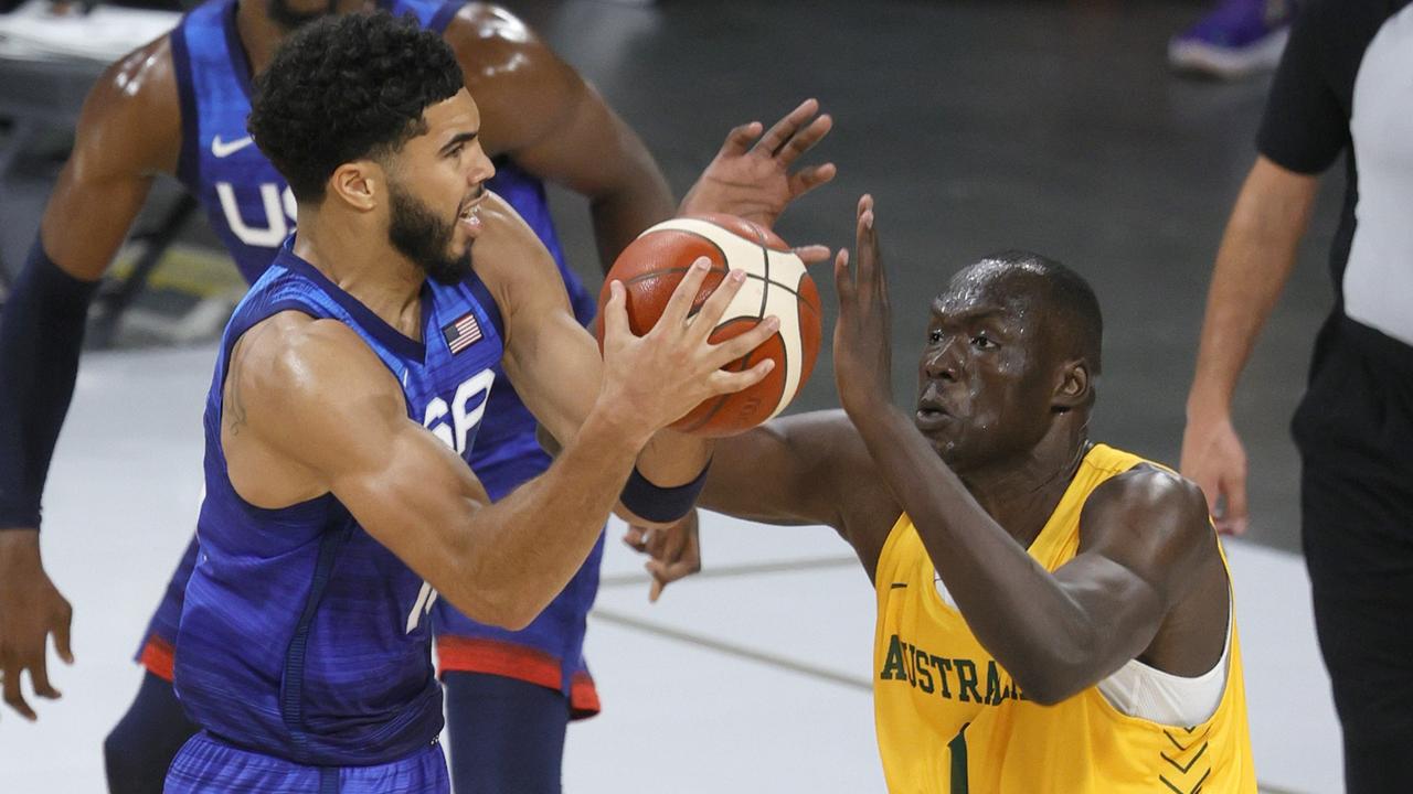 Jayson Tatum of the United States drives against Duop Reath