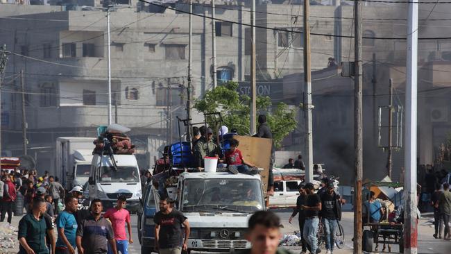 Palestinians transport their belongings as they flee Rafah in the southern Gaza Strip toward a safer area on Sunday. Picture: AFP