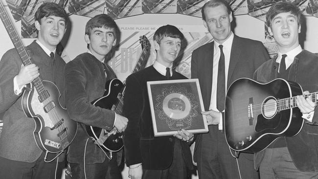 The Beatles: Paul McCartney, George Harrison, Ringo Starr, producer George Martin and John Lennon. Picture: Michael Ochs Archives/Getty