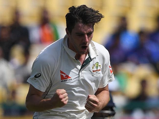 Australia's Pat Cummins leaps in the air as he celebrates the wicket of India's Ravindra Jadeja during the third day of the fourth and last Test cricket match between India and Australia at The Himachal Pradesh Cricket Association Stadium in Dharamsala on March 27, 2017. ----IMAGE RESTRICTED TO EDITORIAL USE - STRICTLY NO COMMERCIAL USE----- / GETTYOUT---- / AFP PHOTO / PRAKASH SINGH / ----IMAGE RESTRICTED TO EDITORIAL USE - STRICTLY NO COMMERCIAL USE----- / GETTYOUT