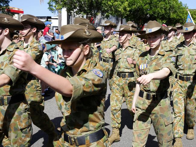 CROWDS lined the road, 10 deep in places, cheering, waving flags and ...