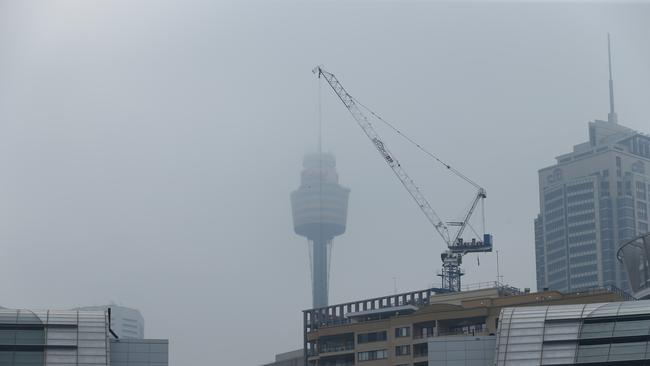 Sydney Tower almost disappeared in the haze. Picture: Rohan Kelly