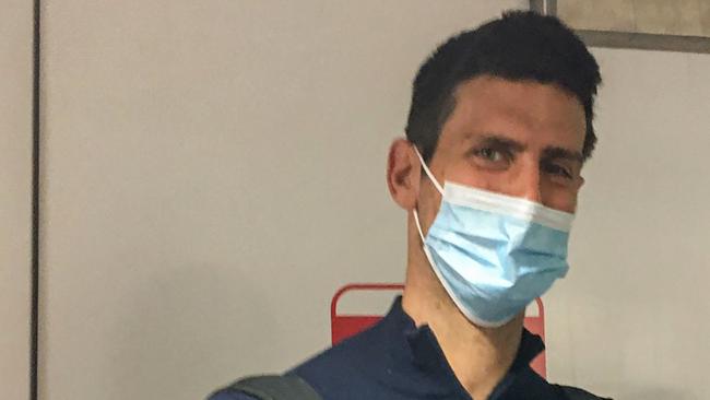 TOPSHOT - Serbia's tennis champion Novak Djokovic disembarks from a plane after being deported in 2022