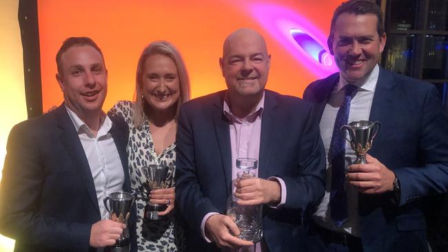 Herald Sun reporters Sam Landsberger, Lauren Wood, Mark Robinson and Jon Ralph with their AFMA gongs.