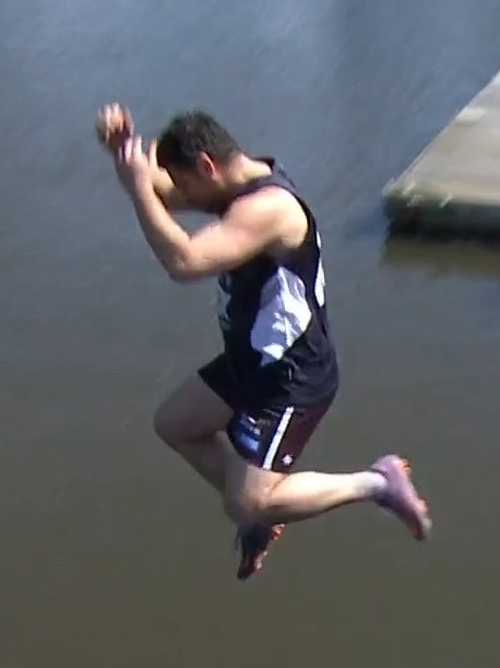 Brendan Fevola jumps into the Yarra River. Photo: Fox Footy.