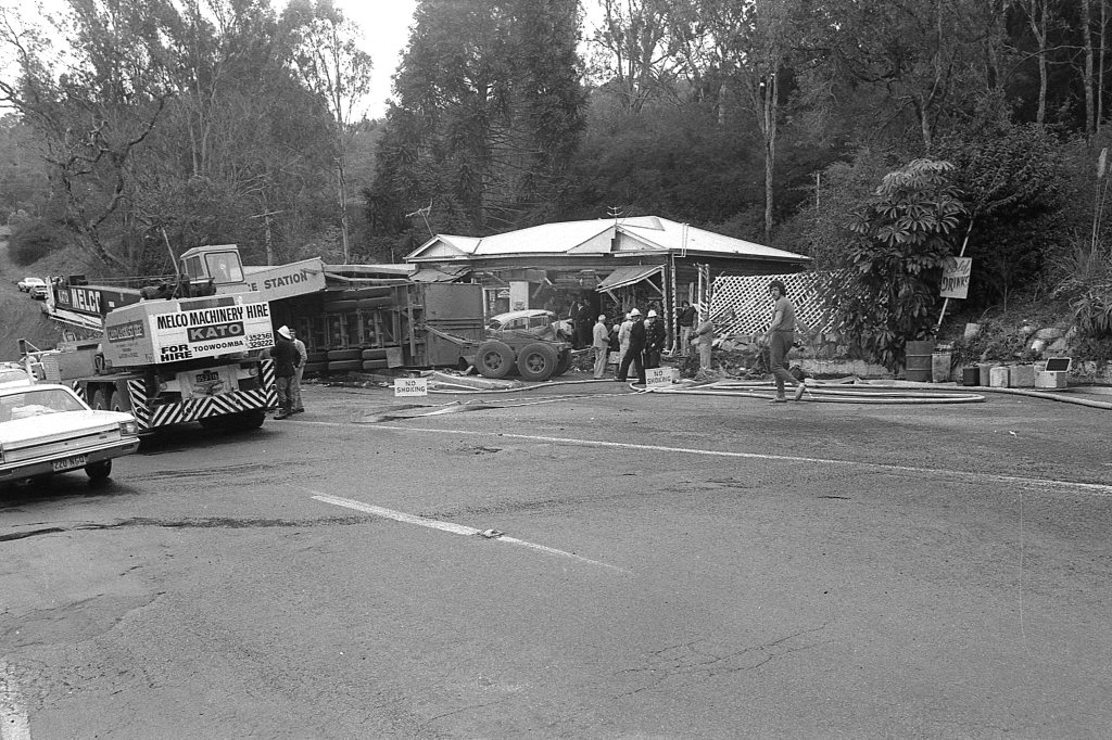 Historic: Toowooba: Accidents Semi-trailer crash at the Log Cabin Service Station on the Toowoomba Range in on 6th September,1978. Three men suffered minor injuries during the crash when the semi-trailer rolled taking out petrol bowsers. A car parked at the service station was also damaged. Photo: Bruce Mackenzie / The Chronicle Neg U869. Picture: Bruce Mackenzie