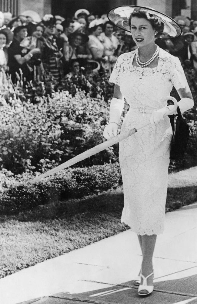 Queen Elizabeth II wears a slim-fitting white lace dress to a garden party in Sydney. Picture: Keystone/Hulton Archive/Getty Images