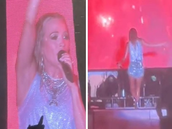 Carrie Underwood falls off stage at concert.