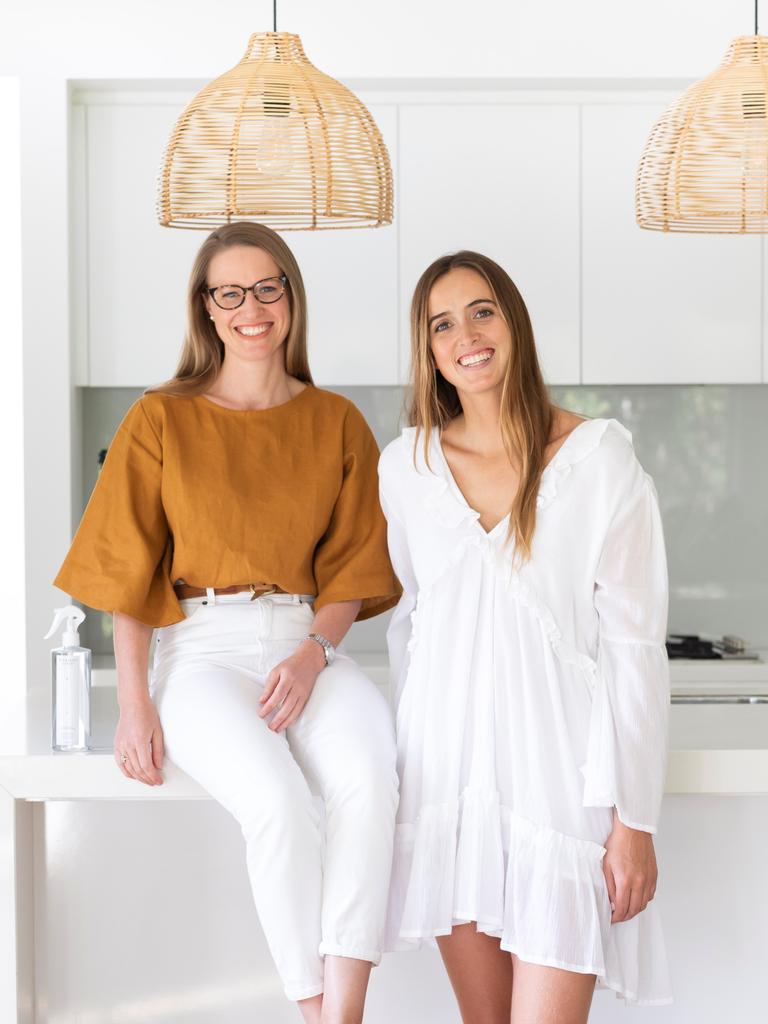 Cleaning up in the kitchen without plastic containers are Ami Bateman and Sian Murray.