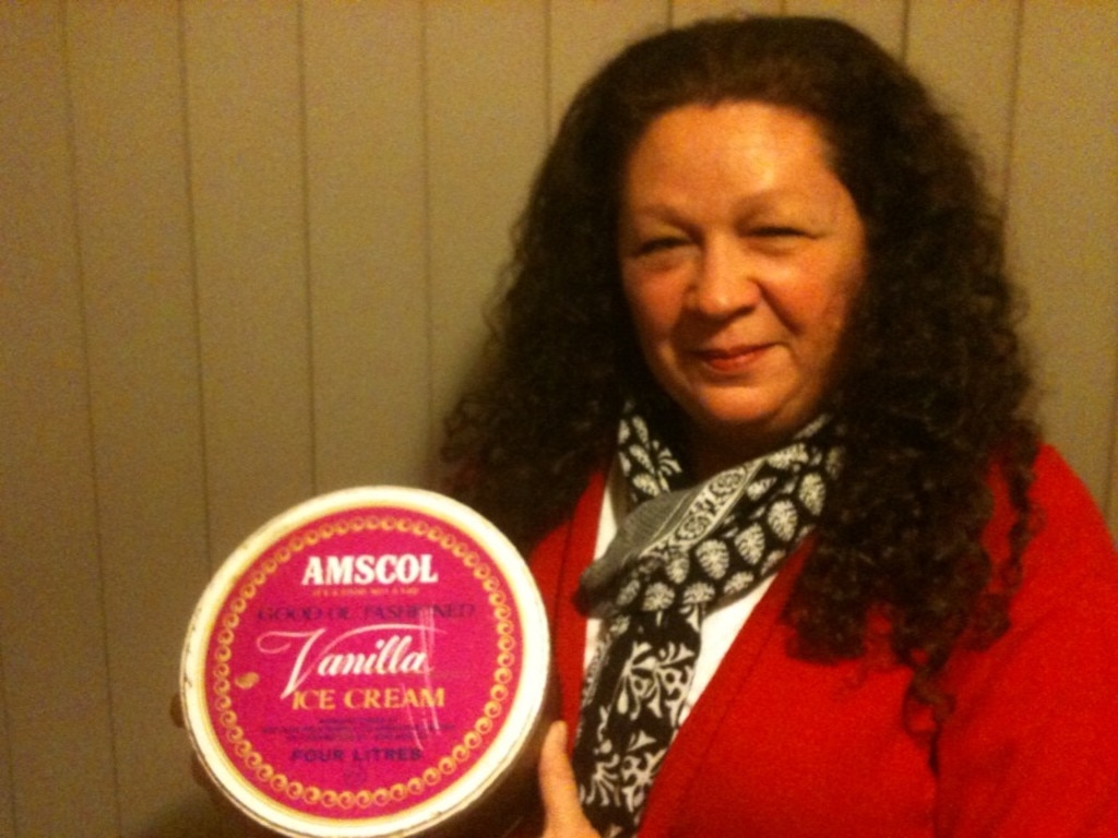 AMSCOL ice cream lover Pamela Clark with one of the round 4L ice cream tins.