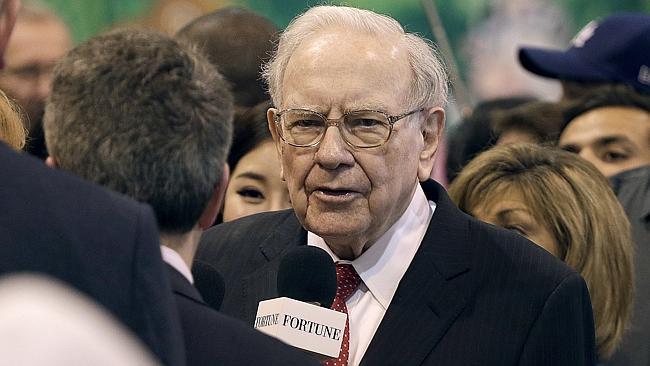 Warren Buffett mingling before presiding at the Berkshire Hathaway meeting.