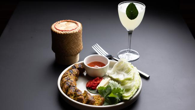 Sai ua sausage with the Market Gimlet cocktail. Picture: David Kelly