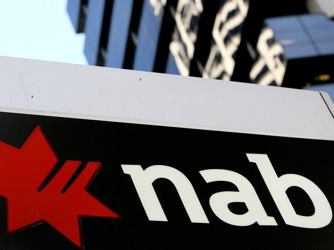 A combo of file photos created on March 30, 2010 shows the Australian headquarters of AXA in Melbourn (top) on August 6, 2004, and a National Australia Bank (NAB) sign in Sydney on May 3, 2006. France's AXA SA and National Australia Bank agreed mARCH 30, 2010 on a 14 billion Australian dollar (12.8 billion USd) takeover of financial services group AXA Asia Pacific. AFP PHOTO / FILES / GREG WOOD (bottom) / WILLIAM WEST (top)