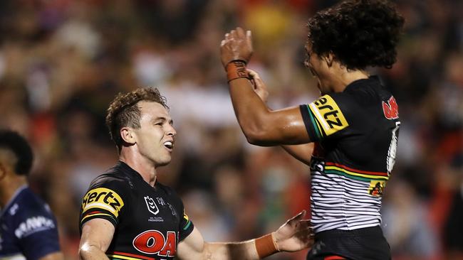 SYDNEY, AUSTRALIA - MARCH 13: Dylan Edwards and Jerome Luai of the Panthers celebrate Edwards scoring a try during the round one NRL match between the Penrith Panthers and the North Queensland Cowboys at Panthers Stadium, on March 13, 2021, in Sydney, Australia. (Photo by Mark Kolbe/Getty Images)