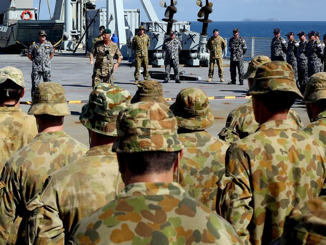 PLEASE CREDIT PHOTOGRAPHER: Leading Seaman Paul McCallum.Colonel Jim Hutton, OBE, Commander Amphibious Task Force, addresses the ship's company and embarked forces of HMAS Choules and 2RAR before beginning phase two of Exercise Sea Dawn 2014. *** Local Caption *** All three Services of the Australian Defence Force (ADF) have come together in joint amphibious training as part of Exercise Sea Dawn in North Queensland 24 March - 16 April 2014. The exercise provides Navy, Army and Air Force personnel with the chance to work closely together and develop critical skills necessary for the ADF's development of a joint capability, which will soon be able to execute the full spectrum of amphibious operations. The exercise involves the Amphibious Task Group with joint enablers from across the ADF.