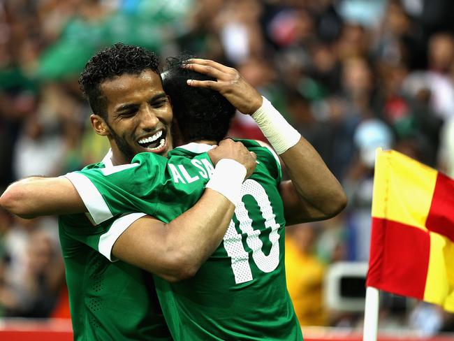 MELBOURNE, AUSTRALIA - JANUARY 14: Al Sahlawi Mohammed of Saudi Arabia celebrates with team-mate Hazazi Naif of Saudi Arabia after scoring a goal during the 2015 Asian Cup match between DPR Korea and Saudi Arabia at AAMI Park on January 14, 2015 in Melbourne, Australia. (Photo by Robert Prezioso/Getty Images)