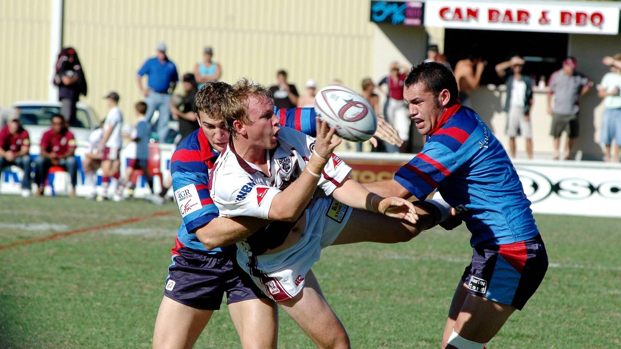 Burleigh Bears’ Scott Cooke is tackled by Toowoomba players Nick Parfitt and Joe Clarke. Picture: Paul Riley