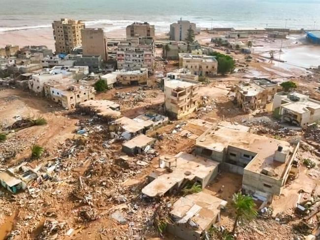 This handout picture released on the account of the Libyan Red Crescent on the X (formerly Twitter) platform on September 13, 2023, shows a general view of destruction in the wake of floods after the Mediterranean storm "Daniel" hit Libya's eastern city of Derna. A global effort to assist stricken Libya gathered pace on September 14 after a tsunami-like flood killed nearly 4,000 people and left thousands missing. Military transport aircraft from Middle Eastern and European nations, along with ships, have been ferrying emergency aid to the North African country already scarred by war. (Photo by Libyan Red Crescent / AFP) / RESTRICTED TO EDITORIAL USE - MANDATORY CREDIT "AFP PHOTO / HO / LIBYAN RED CRESCENT" - NO MARKETING NO ADVERTISING CAMPAIGNS - DISTRIBUTED AS A SERVICE TO CLIENTS
