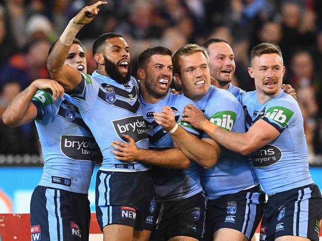 James Tedesco celebrates with teammates. Picture: Getty