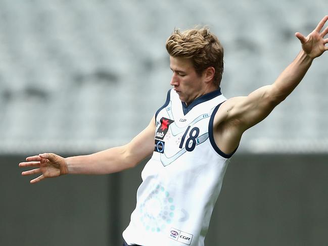 MELBOURNE, AUSTRALIA - JUNE 24:  Mitch Riordan of Vic Country kicks during the U18 match between Vic Country and Vic Metro at Melbourne Cricket Ground on June 24, 2018 in Melbourne, Australia.  (Photo by Robert Prezioso/AFL Media/Getty Images)