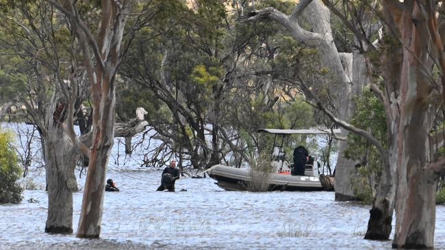 Police searching the area around Ross Lagoon at Taylorville on Monday. Picture: The Advertiser/ Morgan Sette