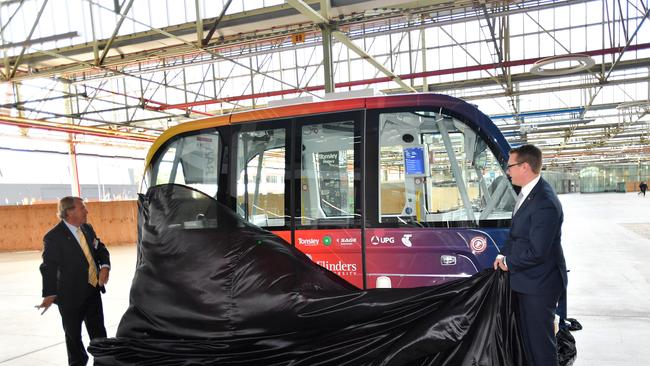 Chancellor of Flinders University Stephen Gerlach (L) and SA Minister for Transport, the Hon. Stephan Knoll are seen unveiling the Flex Autonomous vehicle at Tonsley Park in Adelaide. Picture: AAP